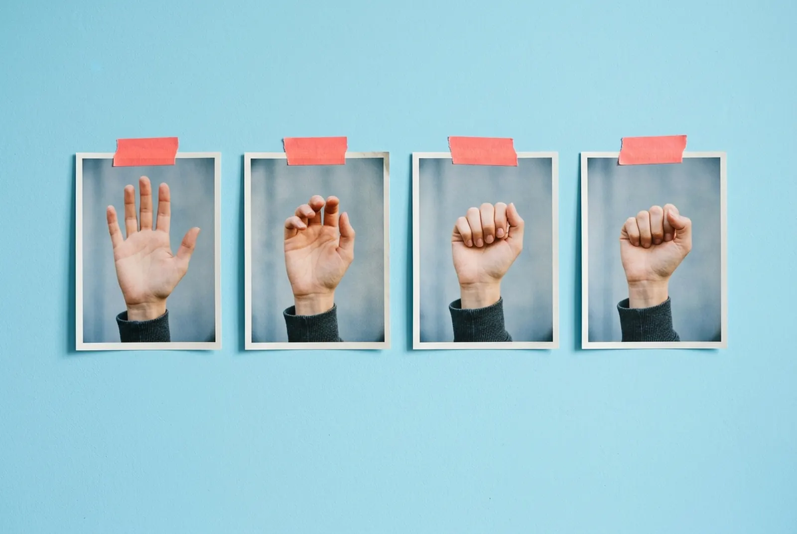 Four physical gesture prints on a light-blue wall